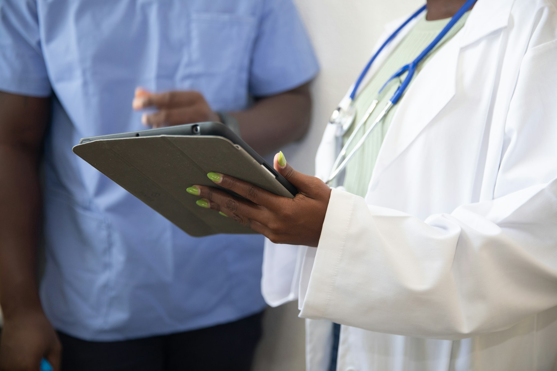 A healthcare leader reviewing performance data with staff